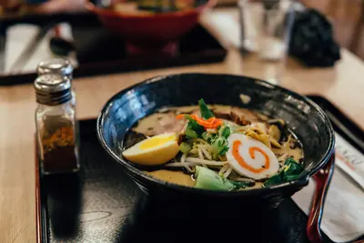 Reference ramen bowl with egg, pork, greens and fish cake
